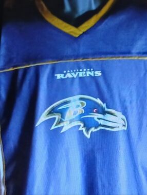 NFL White and Bllue On One Flag Football On One Side. A Raven Team